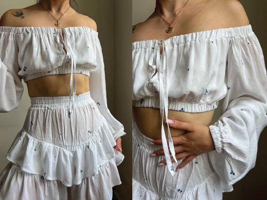 model wearing the serella off shoulder blouse and kiki high waisted shorts made from a pdf sewing pattern bundle, shown as a coordinated two piece outfit.