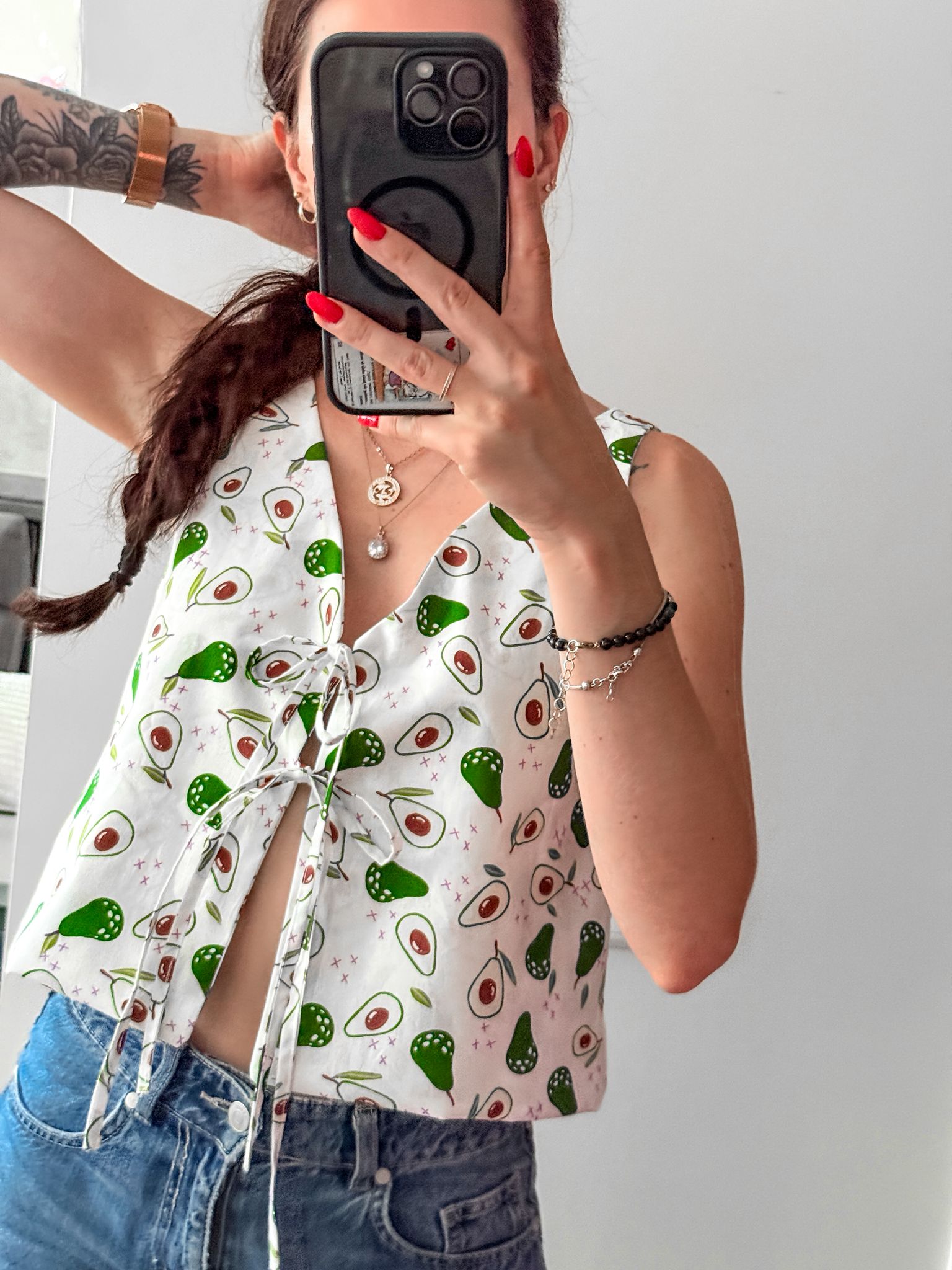 Finished Lani front tie top sewing pattern shown worn as a casual summer top in printed fabric