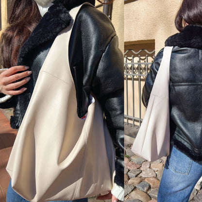 A woman wearing a black faux-leather jacket with a black fur collar and carrying a large cream-colored shoulder bag. The image is a split-screen view showing a close-up on the left and a full-body view on the right in an outdoor setting.