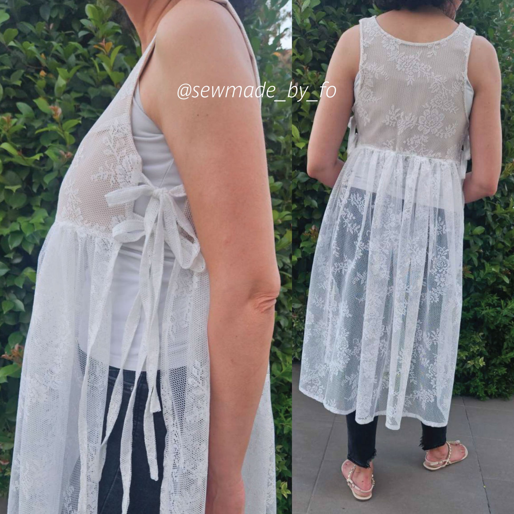 A sleeveless white lace and mesh tunic dress shown on a model from the side and back, featuring a sheer floral lace overlay, a white tank top underneath, and a gathered skirt. The model is standing outdoors in front of green foliage.