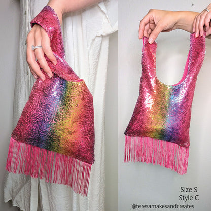 A pink sequined fringe Japanese knot bag made from a sewing pattern, shown in two views, held by a person wearing a white dress. The bag features a vibrant rainbow gradient on the front and bright pink fringe along the bottom.