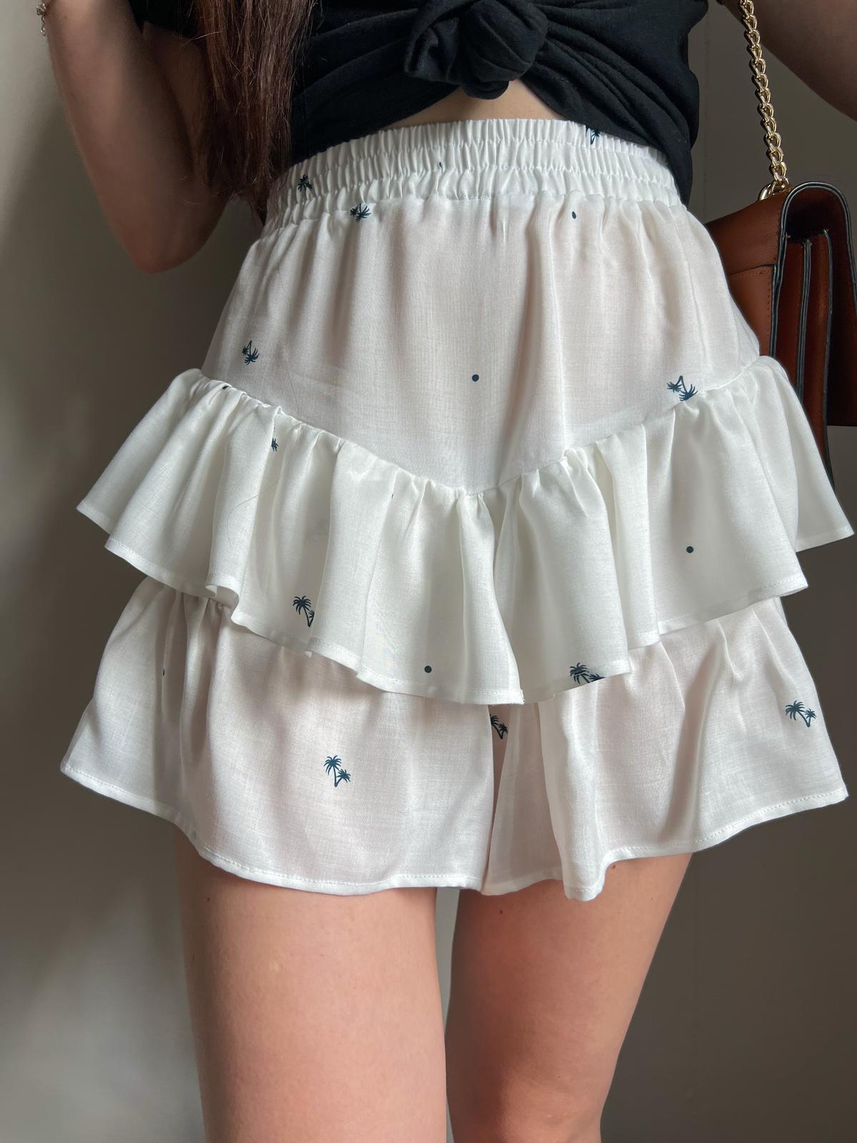 KIKI ruffle shorts with elastic waistband showing layered ruffles and lightweight summer fabric.
