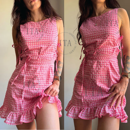Digital sewing pattern cover for the Lila Dress featuring a woman wearing a pink and white gingham ruffle dress with side ties.