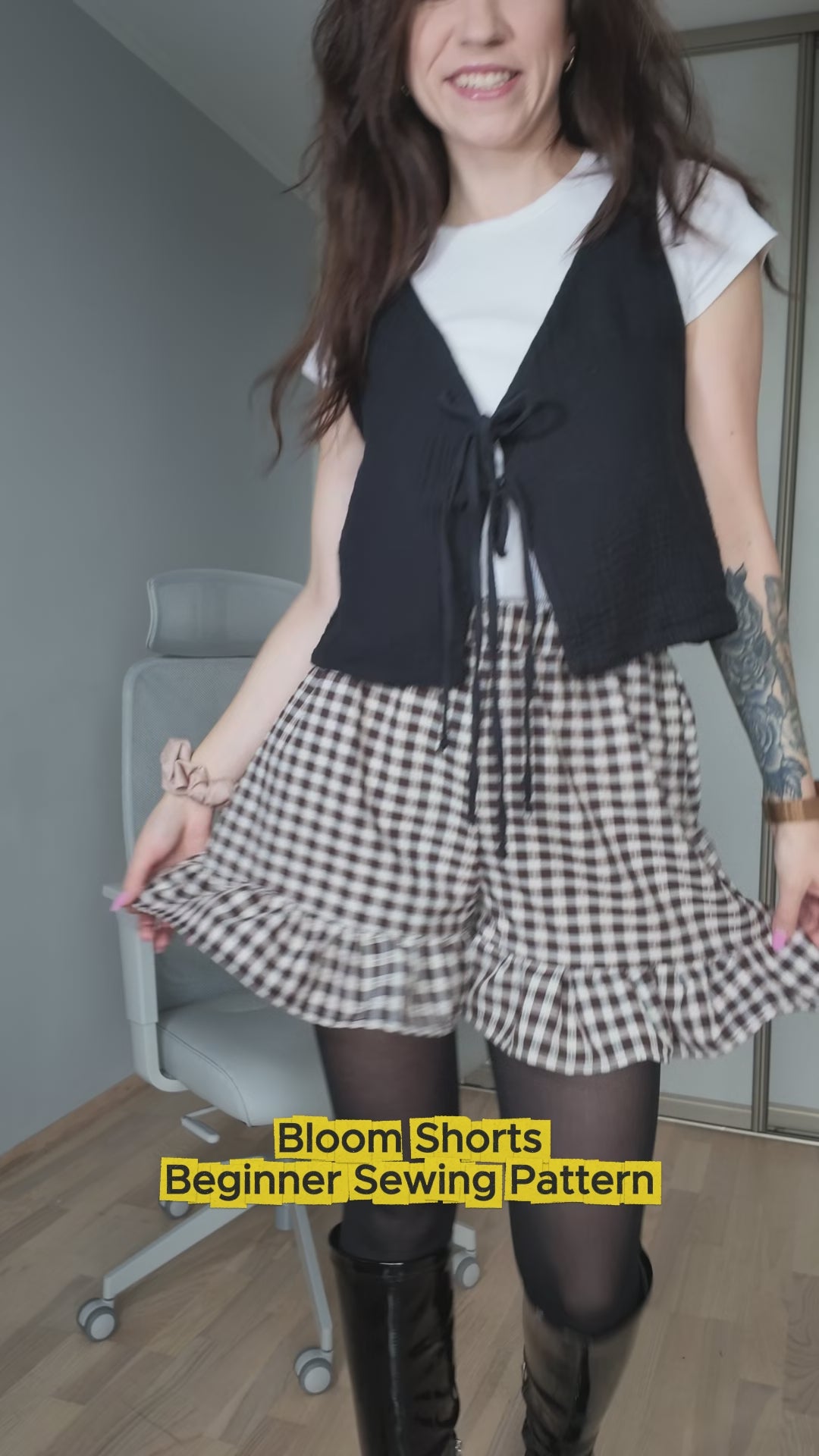 Video of gingham ruffle shorts made with the Bloom Shorts beginner sewing pattern, worn with a black vest