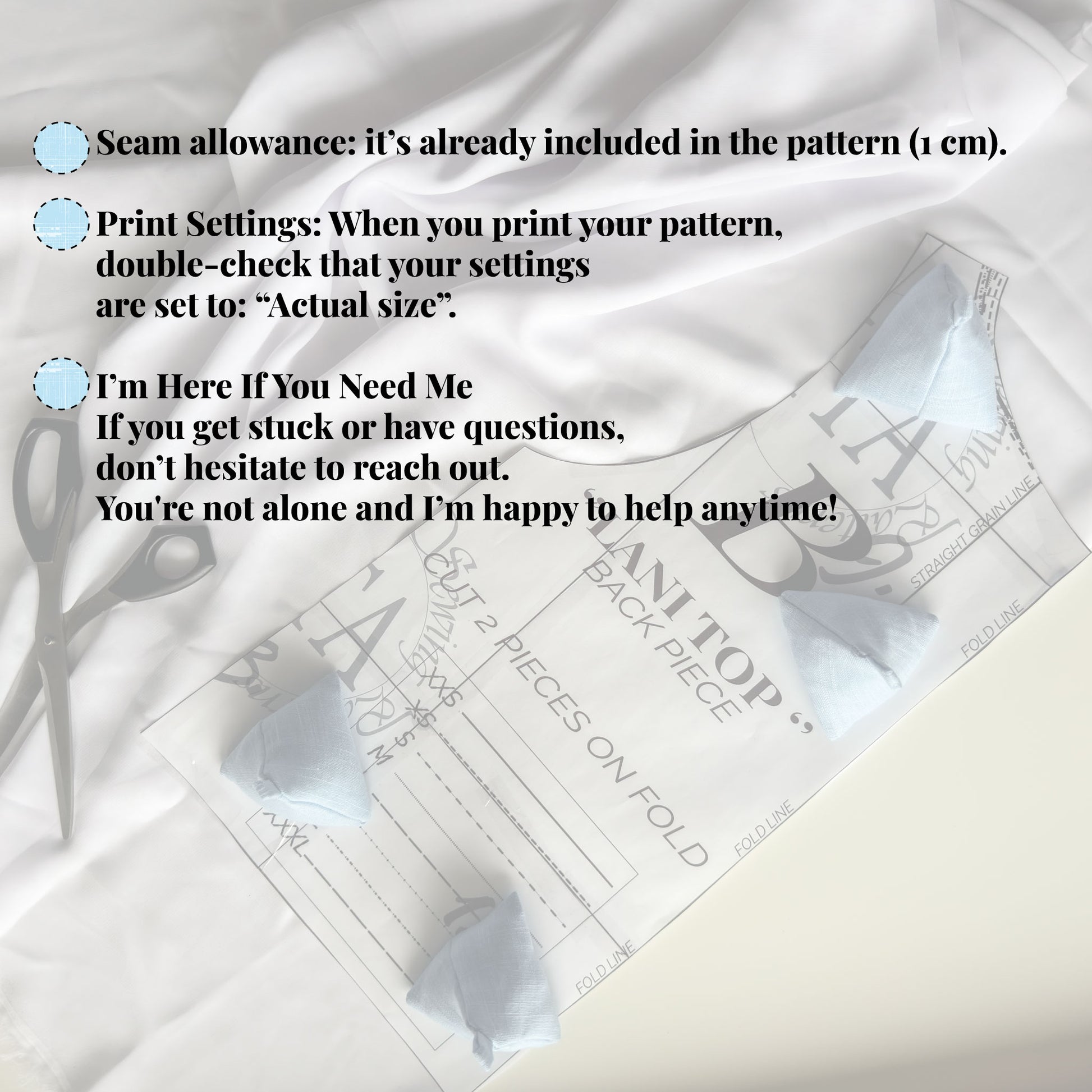 Sewing weights on top of sewing pattern and a pair of scissors on a white background. Seam allowance and other sewing pattern information as overlay.