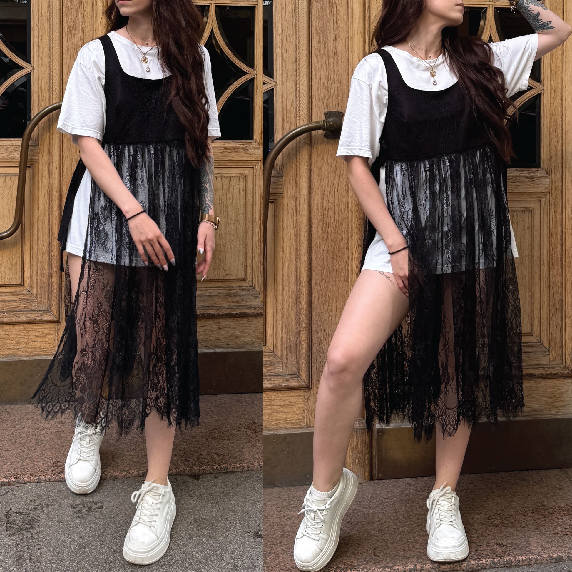 A woman modeling a black lace-trimmed sleeveless dress over a white t-shirt and white shorts, paired with white sneakers, standing in front of a wooden door.