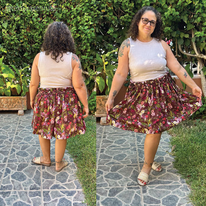 A side-by-side outdoor photo of a woman modeling a floral skirt. The left panel shows her from the back, and the right panel shows her from the front/side as she twirls, wearing a light beige tank top and white heeled sandals.