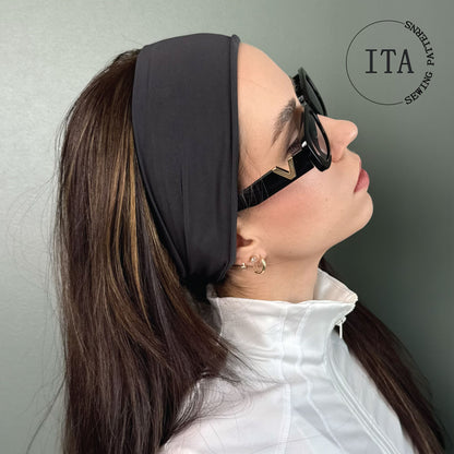 Woman wearing a black headband sewing pattern and sunglasses with 'ITA Sewing' logo in the corner.